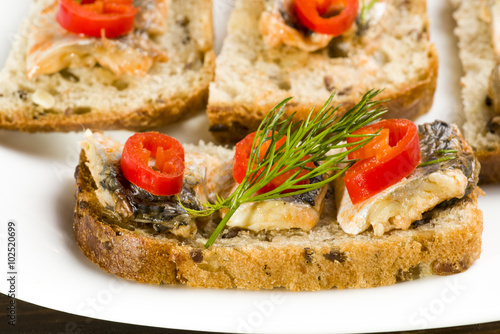 sandwiches with herring, red pepper and dill