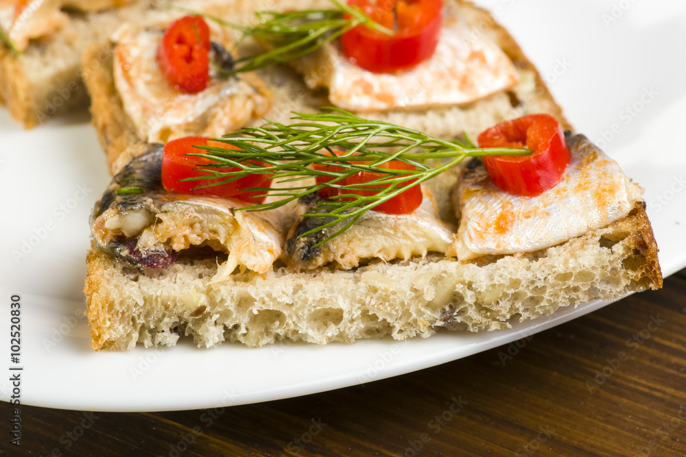 sandwiches with herring, red pepper and dill