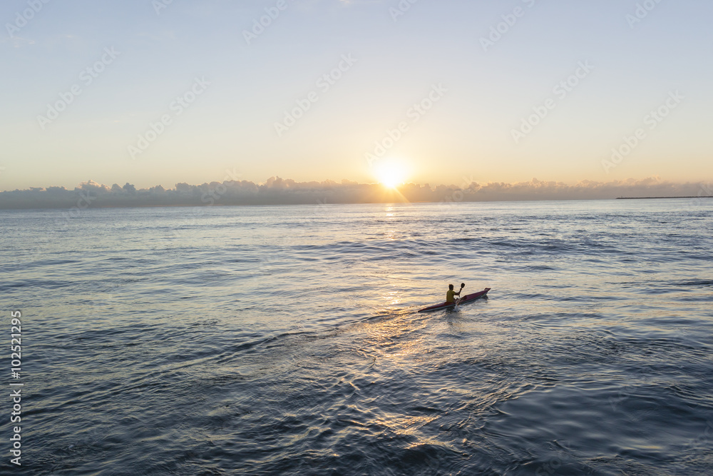 Fototapeta premium Paddler Surf-Ski Craft sunrise paddling training session sunrise ocean waters.