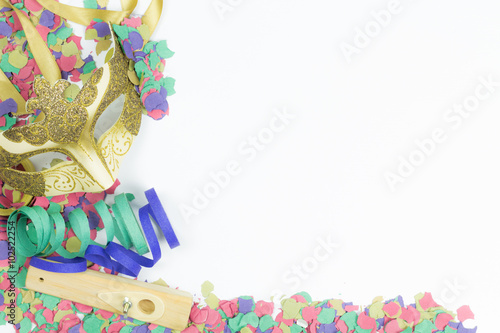 Carnival Venetian mask with confetti and streamers on white background