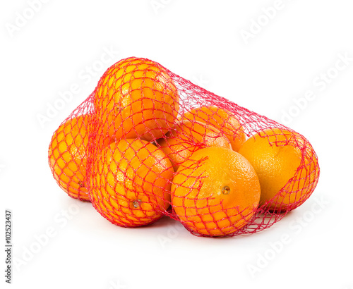 Fresh oranges in mesh sack