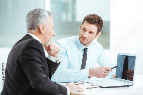 Wallpaper Mural Aged and young businessmen having meeting Torontodigital.ca