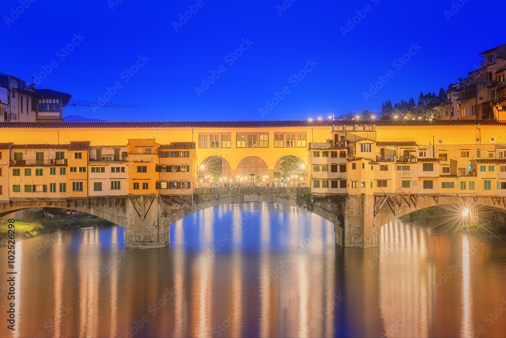 View of medieval stone bridge Ponte Vecchio and the Arno River, Florence