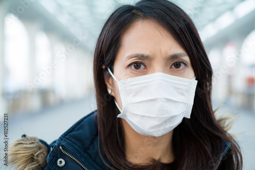 Woman wearing medical mask at outdoor