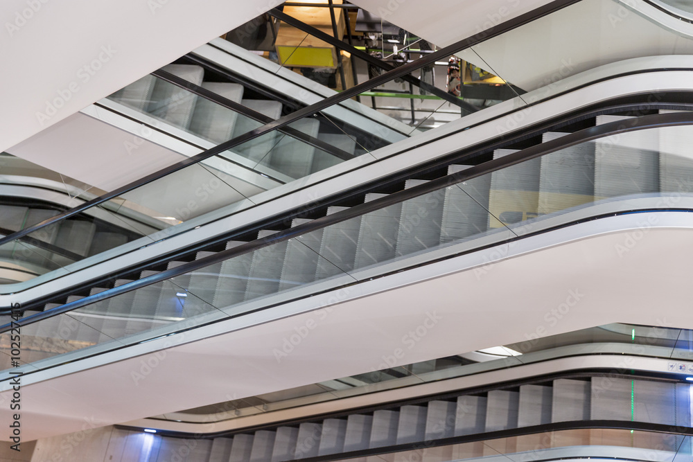 Fototapeta premium Escalator in modern shopping mall