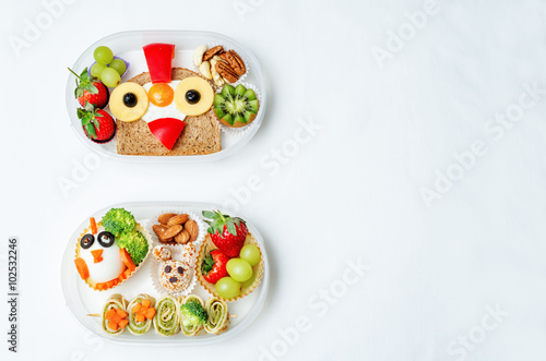 school lunch box for kids with food in the form of funny faces