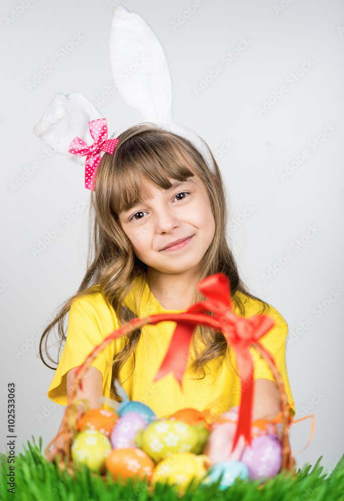 Little girl with basket of Easter eggs Little girl with basket of Easter eggs