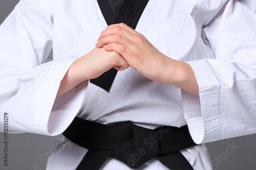 Obraz na plátně The karate girl with black belt