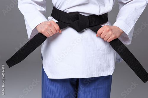 The karate girl with black belt 