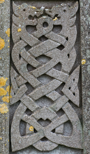 Old stone carved Celtic dragons design 