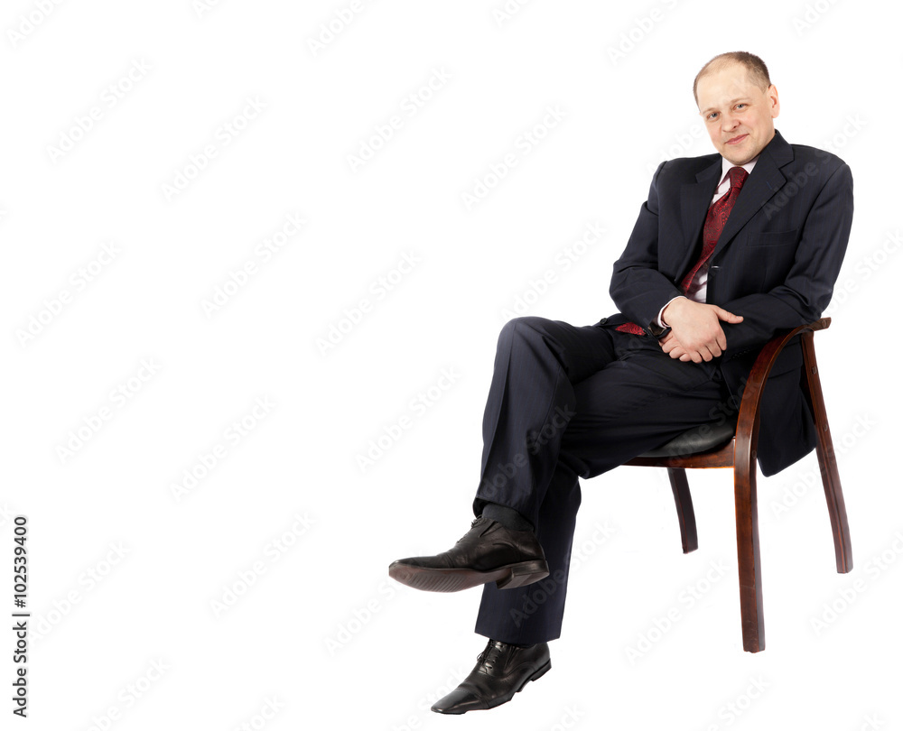 Portrait of a businessman sitting on a chair isolated on white background Portrait of a businessman sitting on a chair isolated on white background