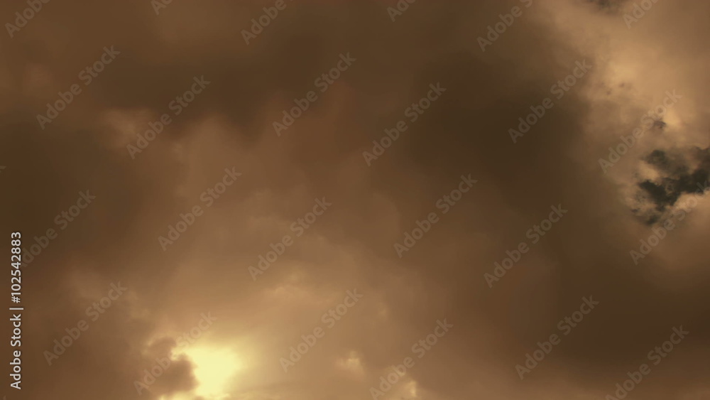 Fantastic Clouds 0212: Time lapse golden clouds travel across a blue sky.