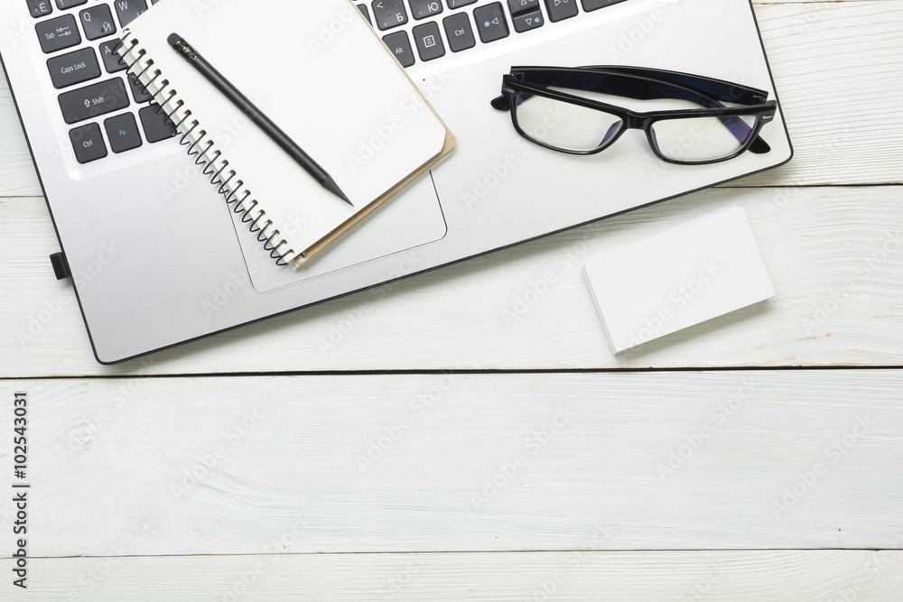 Office desk table with supplies and glasses. Top view. Copy space for text Office desk table with supplies and glasses. Top view. Copy space for text