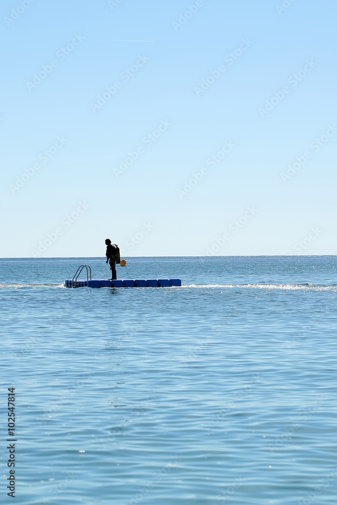 Skin-diver on float board