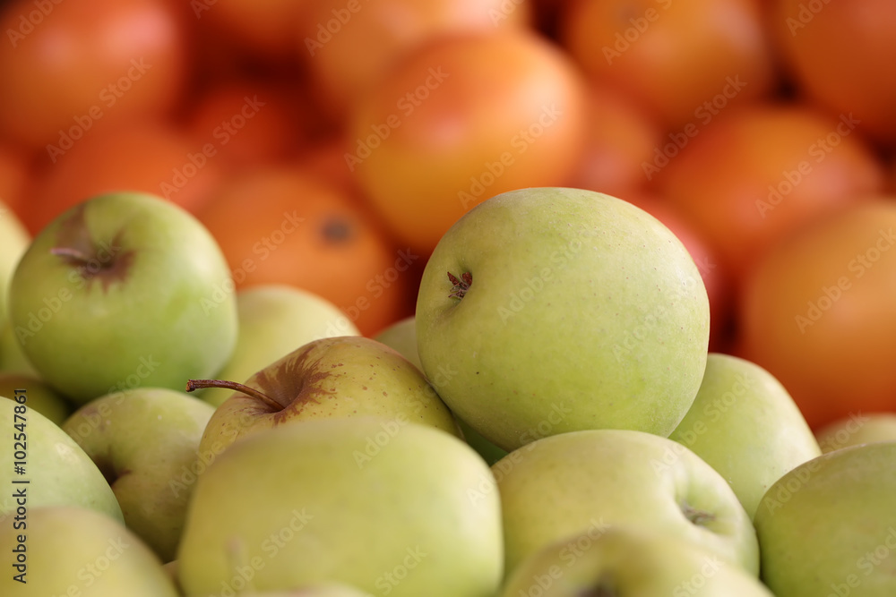 Fresh yellow apples and oranges