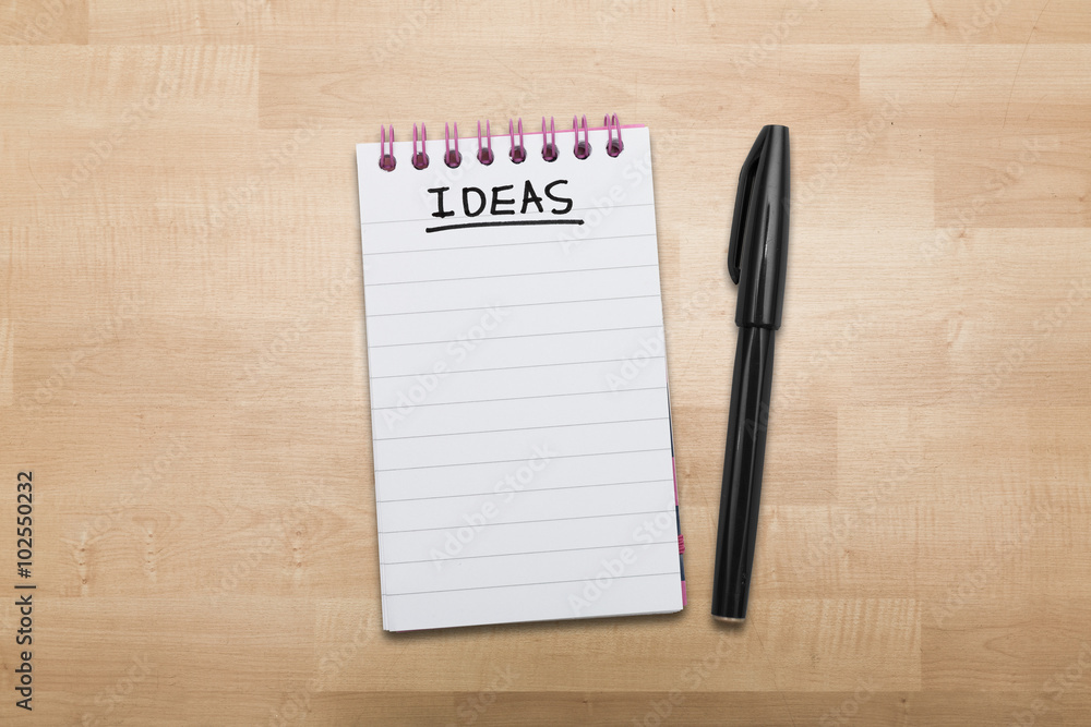 Ideas note pad with pen on wood Ideas note pad with pen on wood