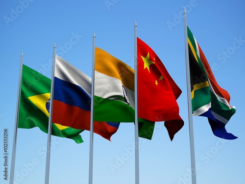 BRICS countries flags waving in the wind with a blue sky background. 3d illustration