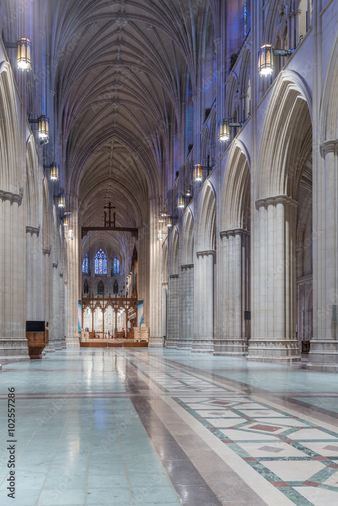 Uncommon interior view, facing the altar,  of Washington National Cathedral with chairs removed. The cathedral was built with small donations during a 97 year period.