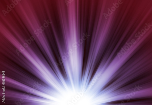 Purple glitter sparkle defocused rays lights bokeh abstract chistmas background.