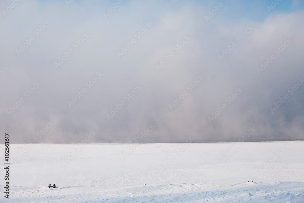 fog, steam on a frozen river