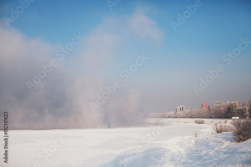 fog, steam on a frozen river