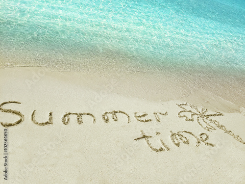 Inscription "Summer" in the sand on a tropical island, Maldives