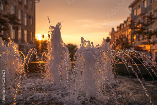 City fountain at sunset. Selective focus with shallow depth of field.