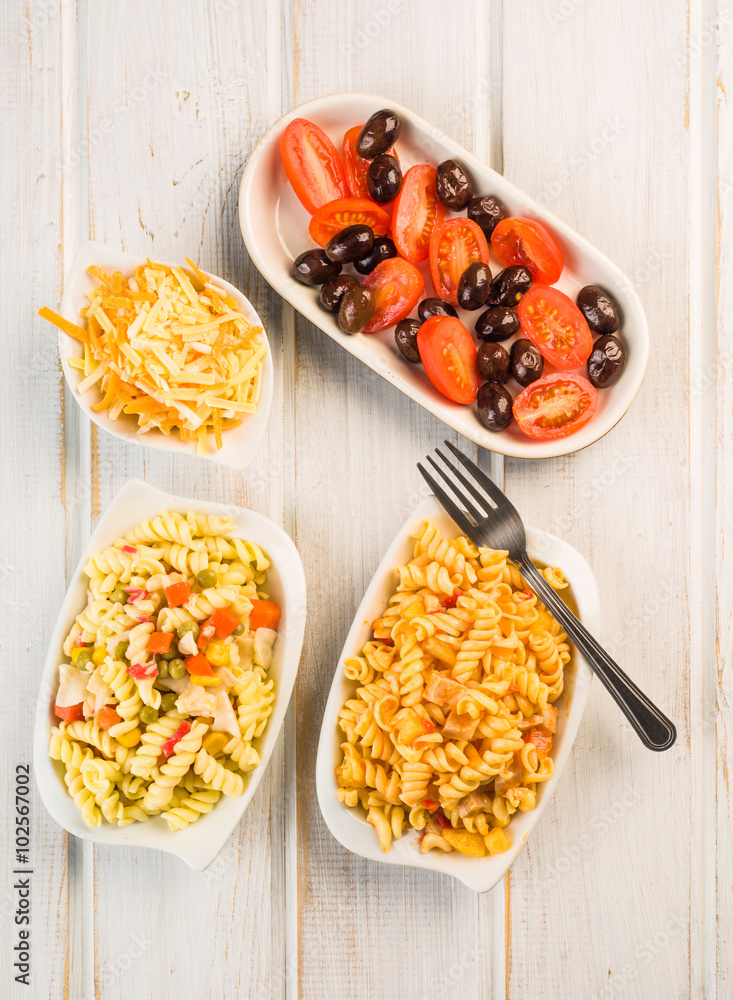 tomato and olive salad and fusilli pasta