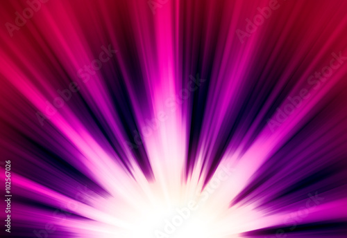 Pink and purple glitter sparkle defocused rays lights bokeh abstract chistmas background.