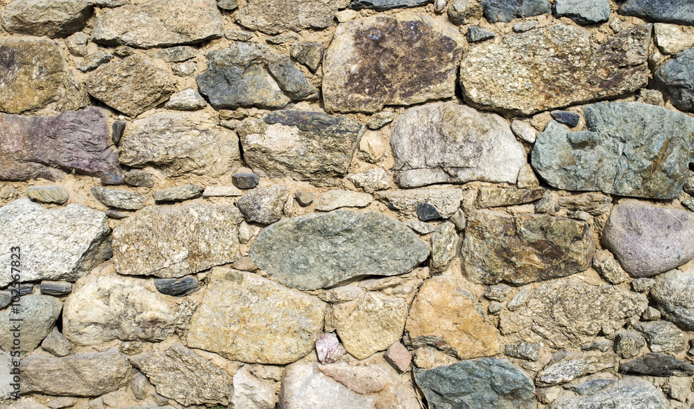 Old colorful stone wall closeup Old colorful stone wall closeup