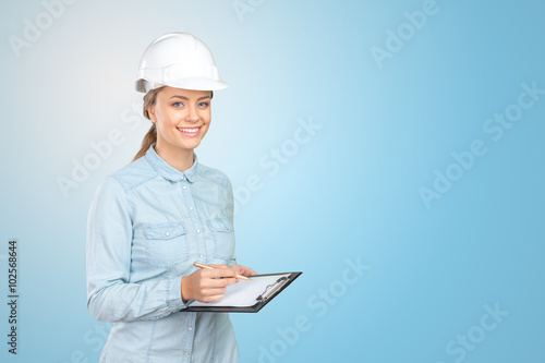 Woman construction worker with hard hat