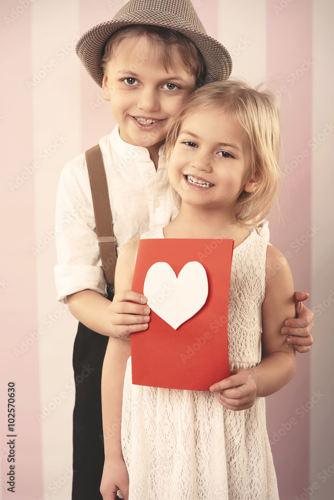 Loving couple with Valentine's card Loving couple with Valentine's card