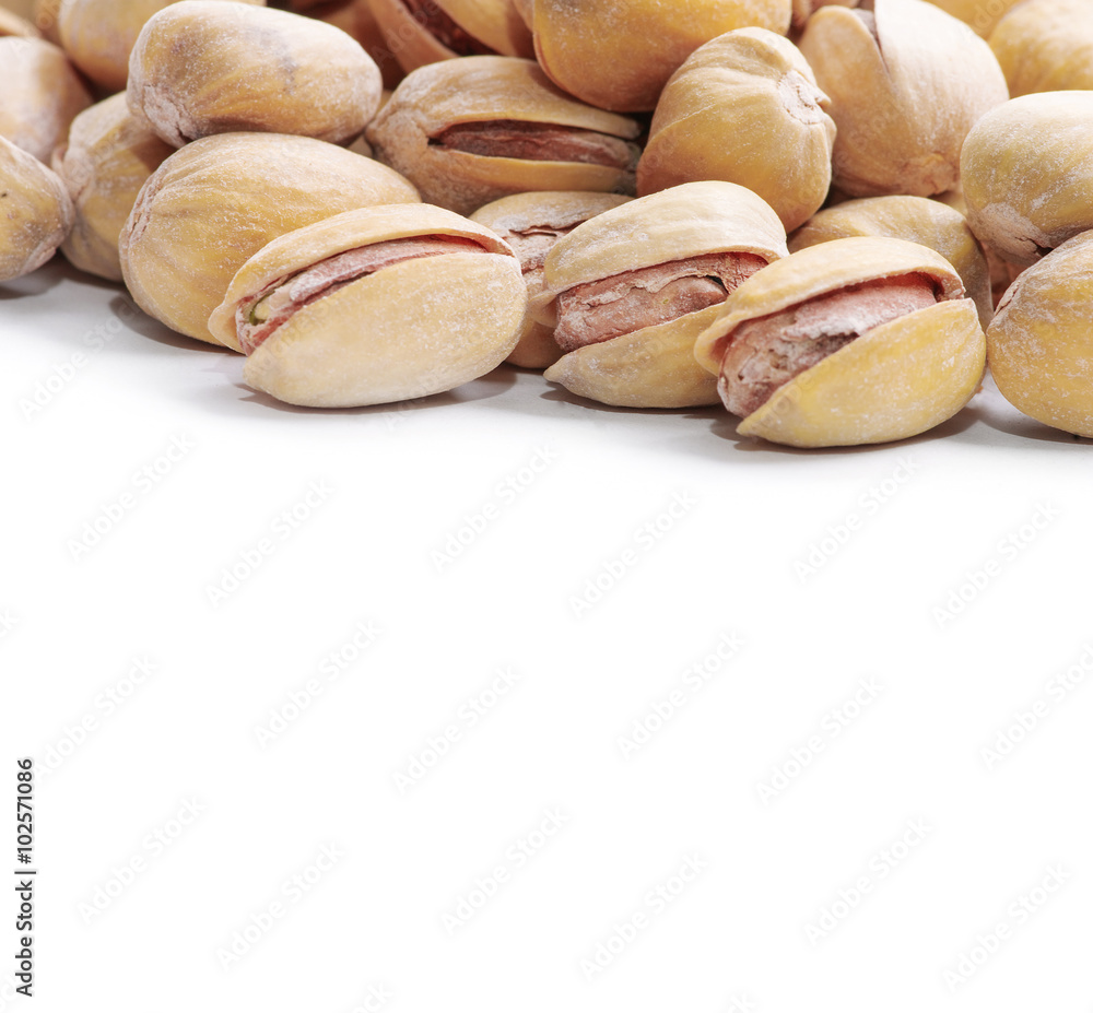 Pistachio nuts. Isolated on a white background. Pistachio nuts. Isolated on a white background.