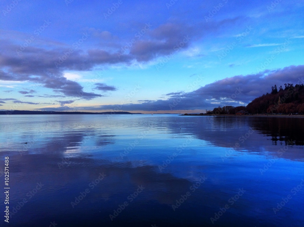 symmetrical reflection of sky on water