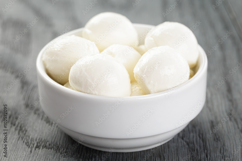 small balls of mozzarella in bowl small balls of mozzarella in bowl