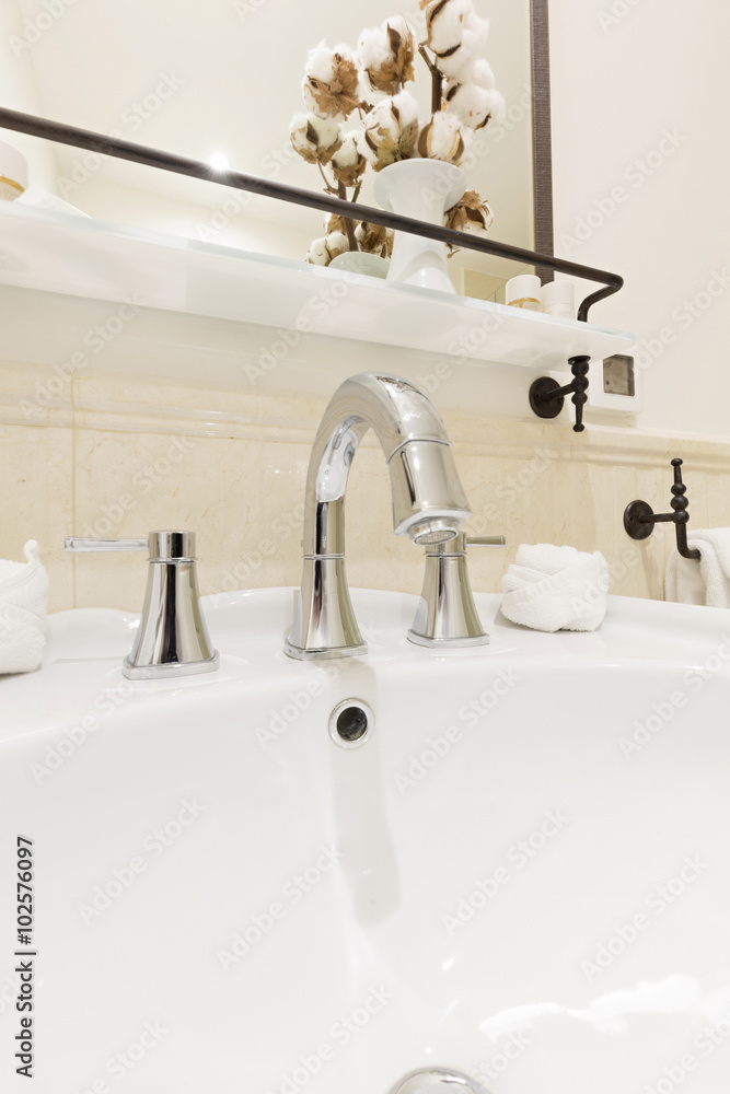 Bathroom interior with white sink and faucet Bathroom interior with white sink and faucet