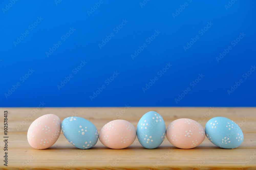 Close up of Easter eggs on a wooden table. Close up of Easter eggs on a wooden table.