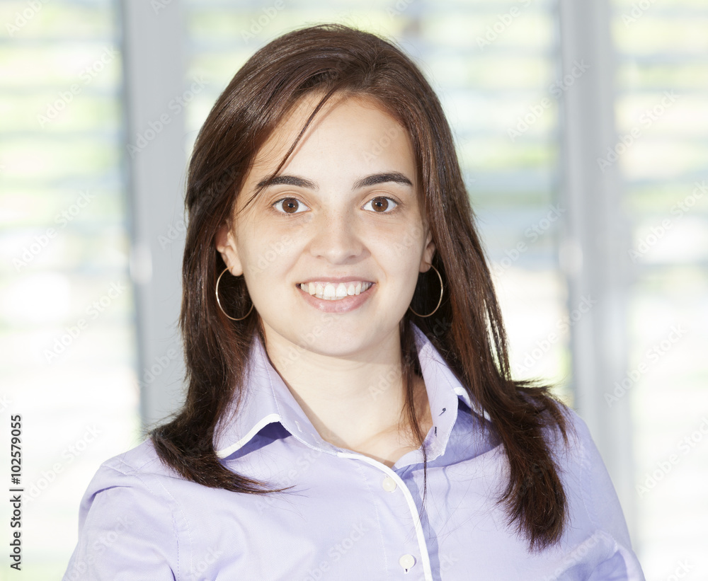 Confident business woman looking confident and smiling Confident business woman looking confident and smiling