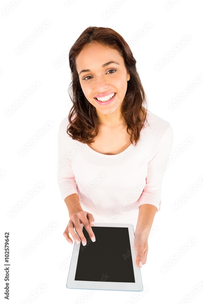 Smiling casual woman using her tablet pc Smiling casual woman using her tablet pc