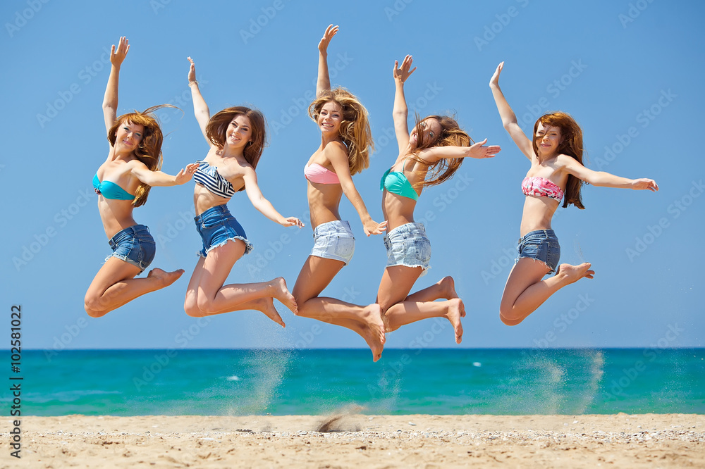 Group of relaxing teenager people on the beach Group of relaxing teenager people on the beach
