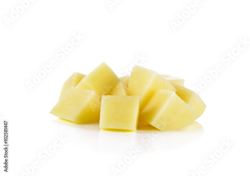 Sliced, peeled raw potatoes on white background