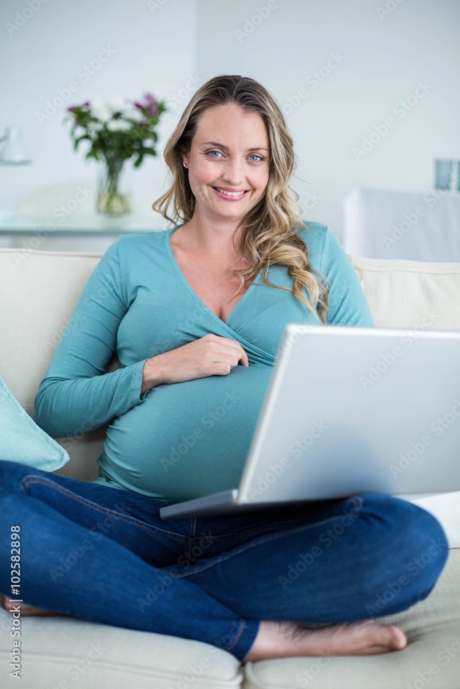 Pregnant woman using a laptop Pregnant woman using a laptop