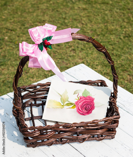 Pink rose painting in a basket