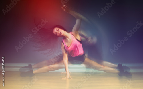 Modern hip hop dancer woman, motion blur