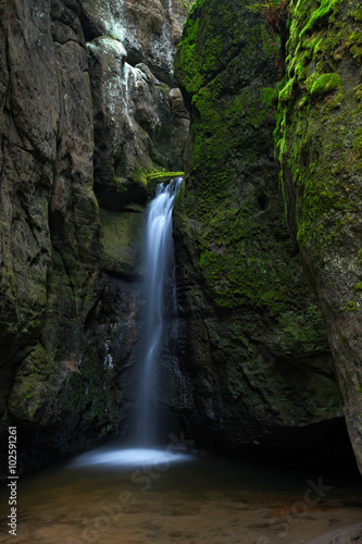 Waterfall Maly Adrspassky vodopad in the rock mountain Adrspasske skaly, Czech republin
