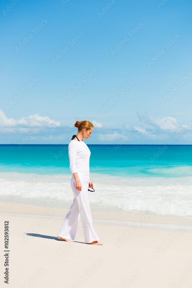Young woman practices yoga on the beach Young woman practices yoga on the beach