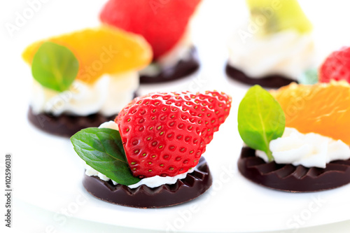 fruits on the chocolate with whipped cream