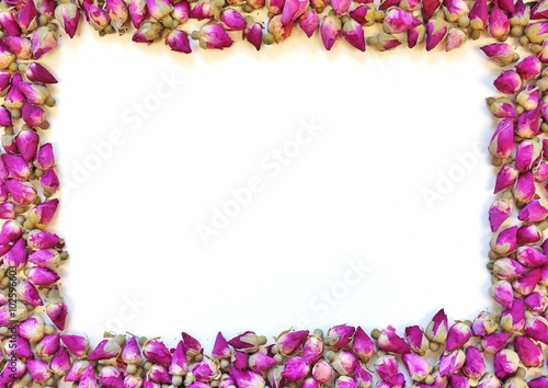 Border frame of romantic dried pink rose buds
