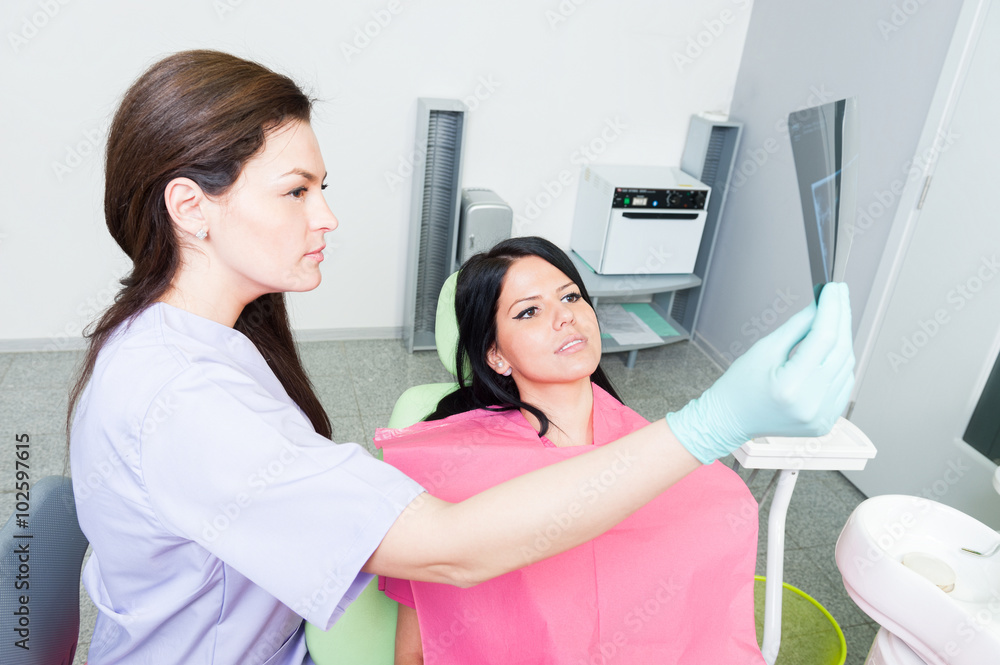 Dentist doctor and patient examining teeth xray Dentist doctor and patient examining teeth xray