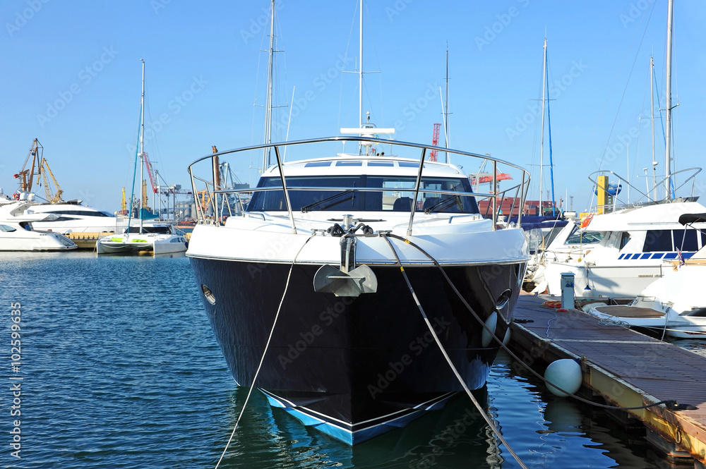 Motor yacht over harbor pier, Odessa, Ukraine Motor yacht over harbor pier, Odessa, Ukraine